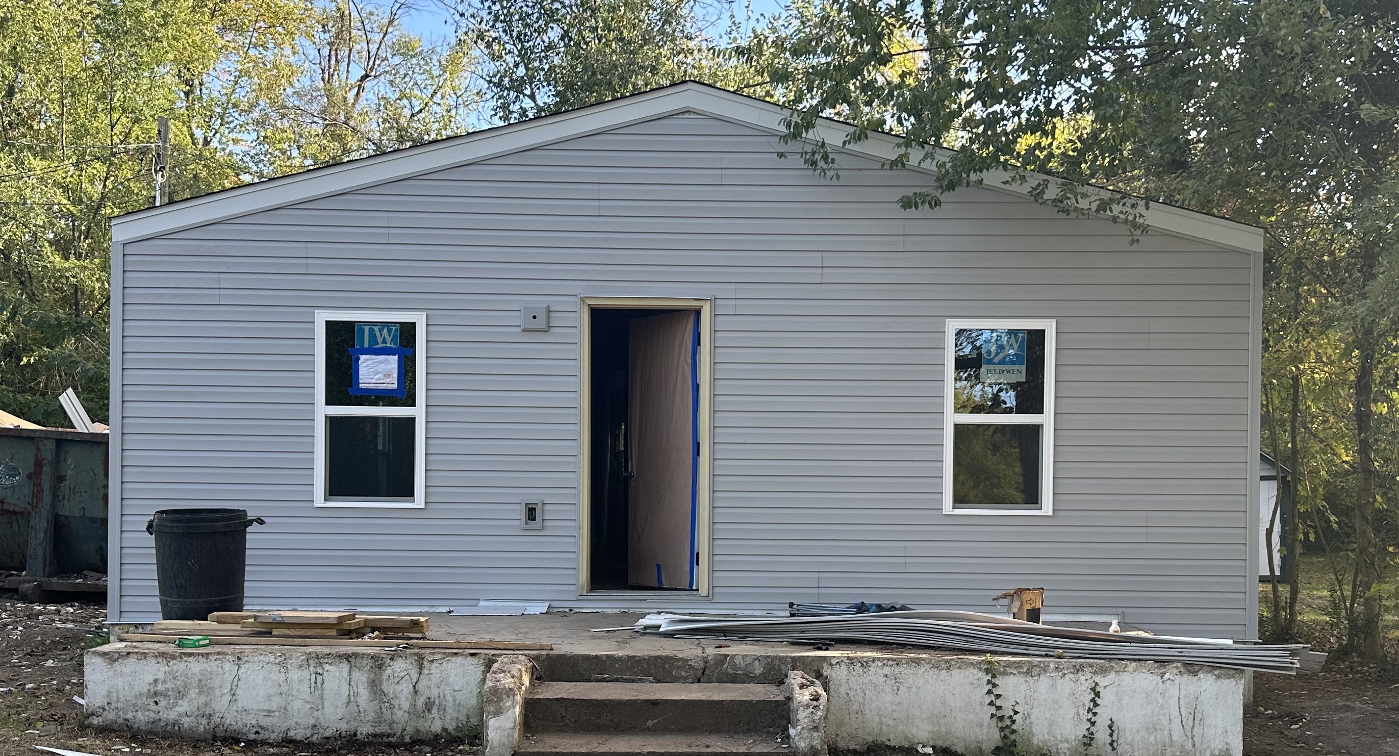 Marion Ohio home exterior after restoration by McDonald and Sons &mdash; new siding, roofing, and entry